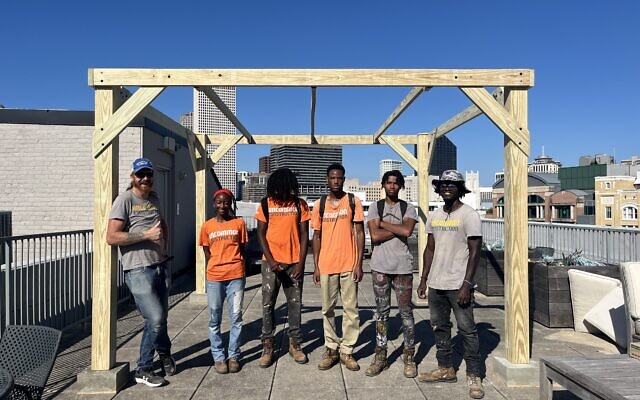 unCommon Construction staff and apprentices build a sukkah on the rooftop of the Museum of the Southern Jewish Experience // Photo Credit: Museum of the Southern Jewish Experience unCommon Construction staff and apprentices build a sukkah on the rooftop of the Museum of the Southern Jewish Experience // Photo Credit: Museum of the Southern Jewish Experience