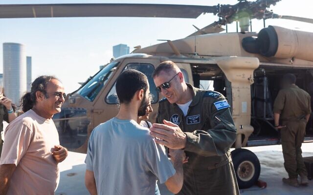 Israeli Air Force chief Maj. Gen. Tomer Bar, right, is seen greeting released hostage soldier Nimrod Cohen and his family at the Re’im base before flying him in a helicopter to a hospital in central Israel, Oct. 13, 2025 // Photo Credit: Israel Defense Forces/Times of Israel