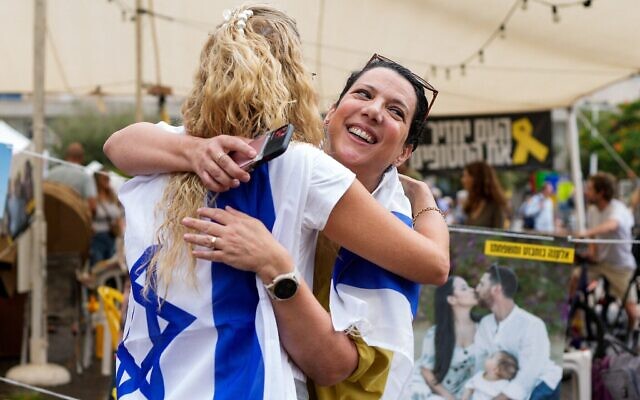 People react at Hostages Square in Tel Aviv on Oct. 9, 2025, following news of the first phase of a new Gaza ceasefire deal that will see the release of all the living captives // Photo Credit: MAYA LEVIN/AFP/Times of Israel