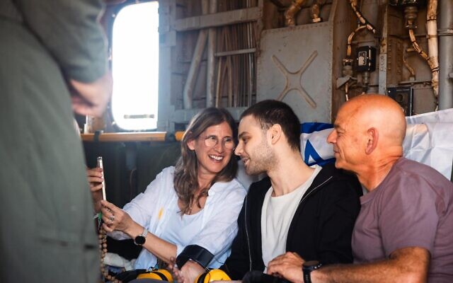 Alon Ohel meets his family at the initial reception point and onboard the helicopter en route to the hospital // Photo Credit:  IDF Spokesperson