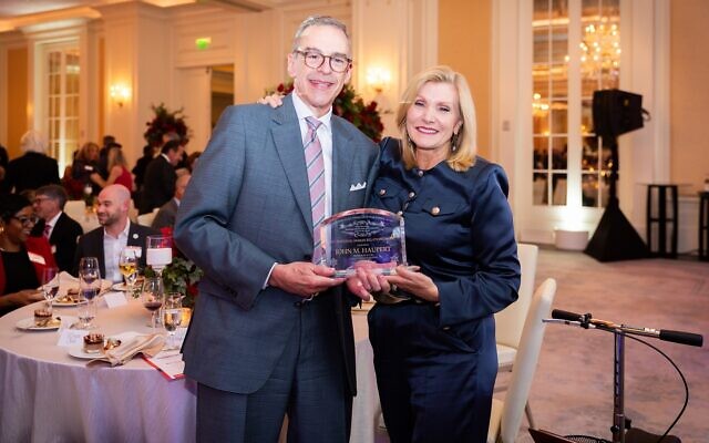 Last year’s award winner, Donna Hyland (right), congratulated this year’s recipient, John Haupert. Last year’s award winner, Donna Hyland (right), congratulated this year’s recipient, John Haupert.