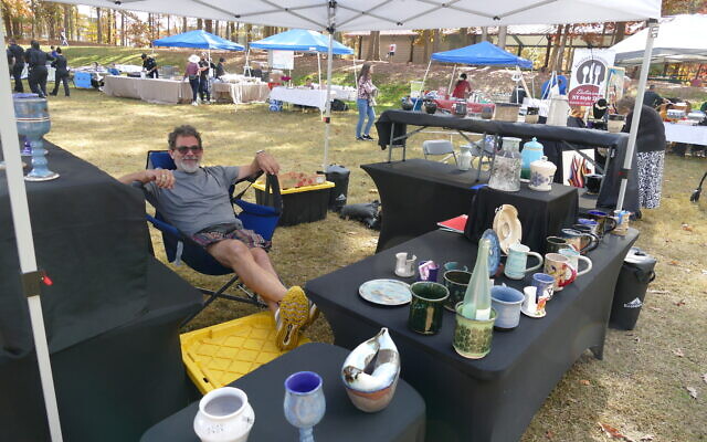 The festival featured several vendors selling their wares. Some, like this gentleman, took a more laid back approach. The festival featured several vendors selling their wares. Some, like this gentleman, took a more laid back approach.