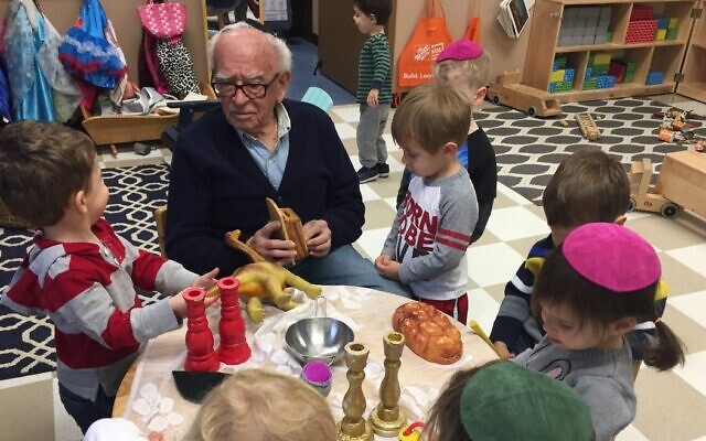 Lou and several preschool students playing with toys in the classroom // Photo Credit: Tiana Plendl Lou and several preschool students playing with toys in the classroom // Photo Credit: Tiana Plendl
