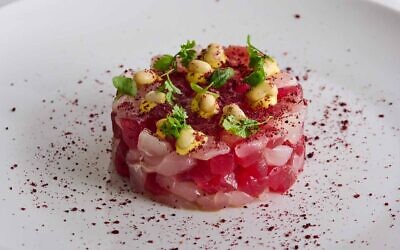 The snapper and tuna tartar, saffron aioli, sumac, and pickled field peas was a novel appetizer.