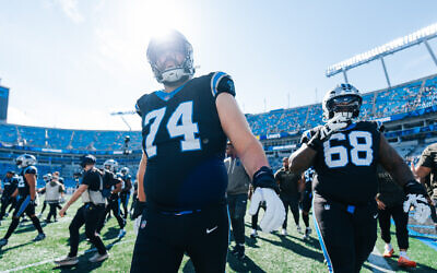 Veteran offensive lineman Jake Curhan (left) of the Carolina Panthers is one of several Jewish NFL players whose teams are jockeying for position in a crowded NFC playoff race // Photo Credit: Carolina Panthers