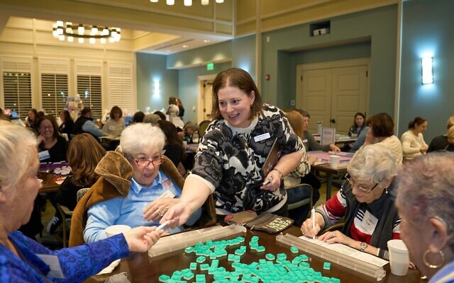 (Standing, center) Carla Birnbaum, director of community engagement for Jewish Federation of Greater Atlanta, is pictured at the recent JGather Host event at Berman Commons.
