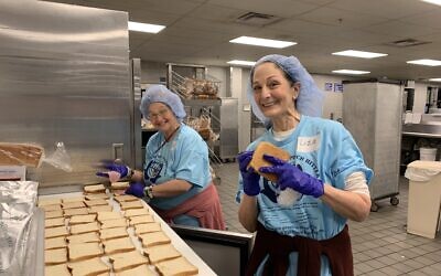 Faye Pous and Liza Dolensky lend a helping hand at the VA on Christmas Day.