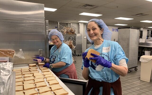 Faye Pous and Liza Dolensky lend a helping hand at the VA on Christmas Day.