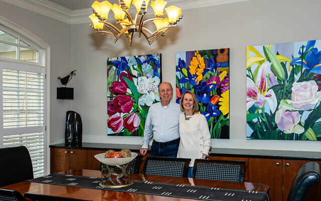 Norman and Jenny Kalmin entertain in their dining room graced by her “Flowers 1,2,3” tryptic // All photos by Howard Mendel Norman and Jenny Kalmin entertain in their dining room graced by her “Flowers 1,2,3” tryptic // All photos by Howard Mendel