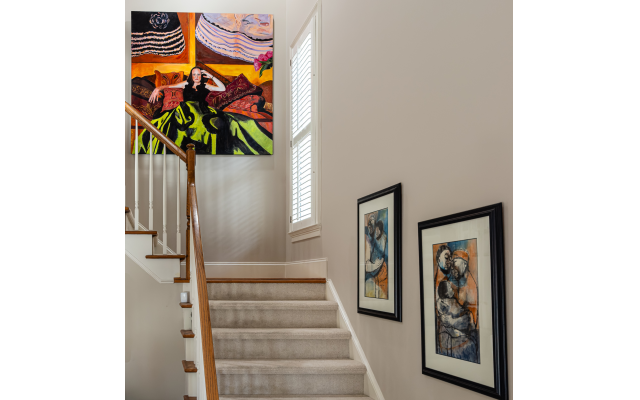 This large painting, “La Dona,” atop the stairs is one of Jenny’s oldest works. The two paintings (right) are by Godfrey Ndaba. This large painting, “La Dona,” atop the stairs is one of Jenny’s oldest works. The two paintings (right) are by Godfrey Ndaba.