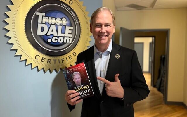Dale Cardwell and his updated best-selling book, “Don’t Get Scammed” // Photo courtesy of TrustDale.com Dale Cardwell and his updated best-selling book, “Don’t Get Scammed” // Photo courtesy of TrustDale.com