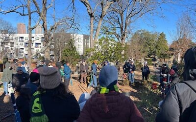Volunteers take part in a ceremonial tree planting at Oakland Cemetery as part of MLK Weekend of Service.