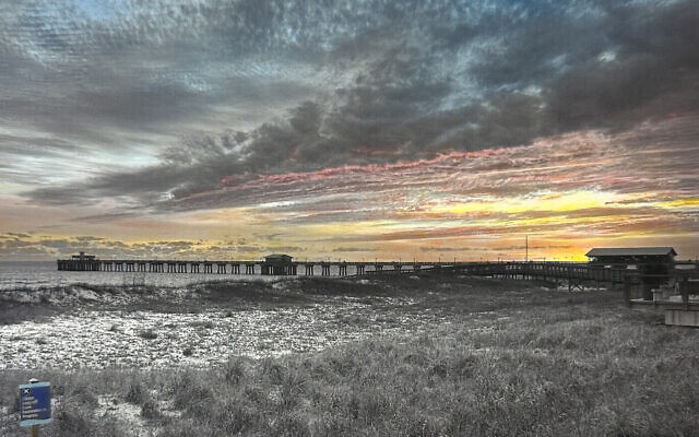 This original Henos, “December Pier,” is oil on paper portraying Gulf Shores, Ala.