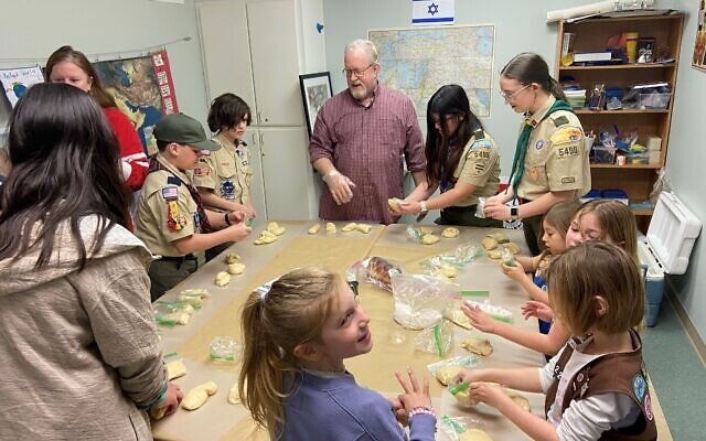 Community activities included challah braiding, where participants learned about the symbolism of this cherished Shabbat tradition while shaping and preparing their own loaves. Community activities included challah braiding, where participants learned about the symbolism of this cherished Shabbat tradition while shaping and preparing their own loaves.