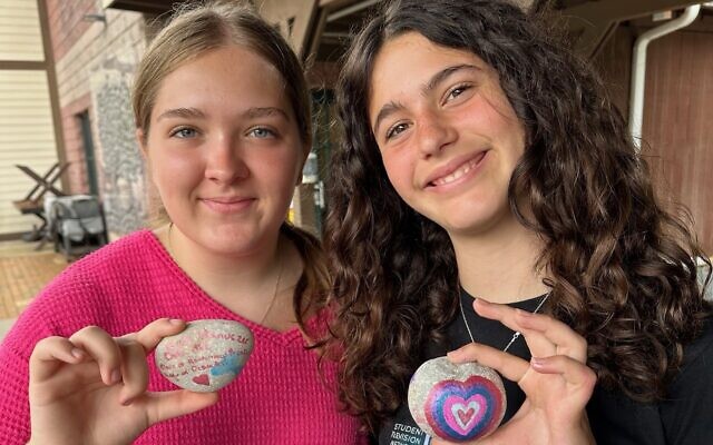Camp Coleman kids proudly show off their Stones of Remembrance. Camp Coleman kids proudly show off their Stones of Remembrance.