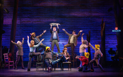 Some cast members in “Come From Away” played more than one part. Lowery Brown (standing in brown jacket and yellow shirt) also portrayed the rabbi.