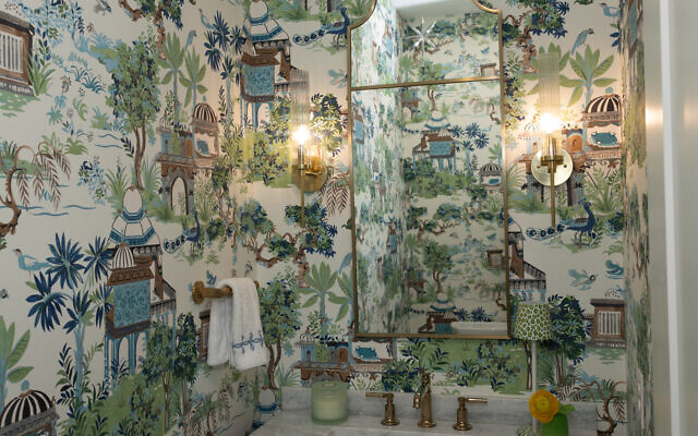 Sally and Kattia believe in making small spaces work hard by using bold wallpaper in the guest powder rooms.