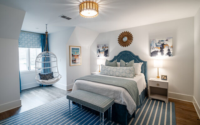 Daughter, Maggie, in graduate school at Boston University, selected a blue palette and hanging chair. She claimed some glamour with custom velvet upholstery. The two abstract paintings flanking her bed are by DeAnn Hebert.