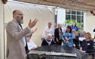Residents enjoy gathering in the sukkah during Sukkot.