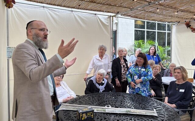 Residents enjoy gathering in the sukkah during Sukkot. Residents enjoy gathering in the sukkah during Sukkot.