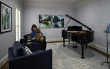 The Eisenberg piano room is painted in  Sherwin Williams North Star and has a rug reminiscent of piano keys. Goldendoodle Lexi has found herself a fine home // All photos by Howard Mendel