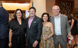 Amy Fox, Chuck Fox, Emily Webb, and Adam Webb pictured at Temple Sinai Preschool’s Ruby Gala.