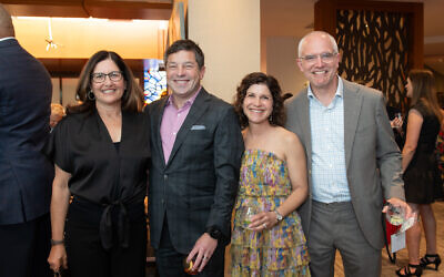 Amy Fox, Chuck Fox, Emily Webb, and Adam Webb pictured at Temple Sinai Preschool’s Ruby Gala.