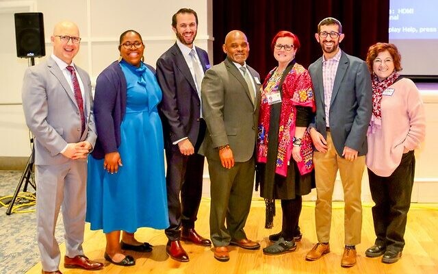 Clergy at the 2026 Atlanta Interfaith Hunger Seder (from left): Robert Kime, Cartersville Stake of the Church of Jesus Christ of Latter-Day Saints; the Rev. Cassandra A. Henderson, Interfaith Children’s Movement; Rabbi Jason Holtz, Temple Kehillat Chaim; the Rev. Sean B. Smith, New Horizon Baptist Church; the Rev. Dr. Lisa Heilig, Toco Hills Community Alliance; Rabbi Eric Feld, Ahavath Achim Synagogue; Rabbi Ellen Nemhauser, Union for Reform Judaism // All photos by Mindy Curry Clergy at the 2026 Atlanta Interfaith Hunger Seder (from left): Robert Kime, Cartersville Stake of the Church of Jesus Christ of Latter-Day Saints; the Rev. Cassandra A. Henderson, Interfaith Children’s Movement; Rabbi Jason Holtz, Temple Kehillat Chaim; the Rev. Sean B. Smith, New Horizon Baptist Church; the Rev. Dr. Lisa Heilig, Toco Hills Community Alliance; Rabbi Eric Feld, Ahavath Achim Synagogue; Rabbi Ellen Nemhauser, Union for Reform Judaism // All photos by Mindy Curry