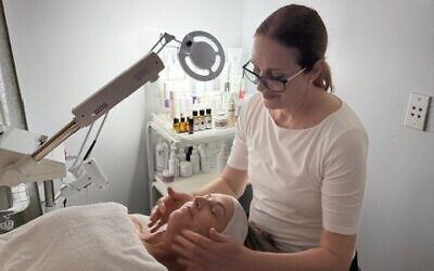 Girgorian is pictured working with a client.