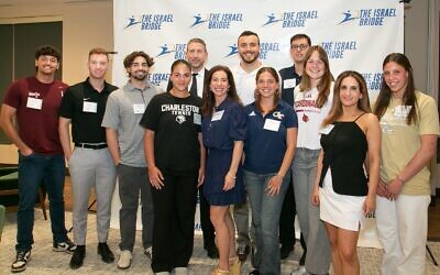 The Israel Bridge Founder Keri Greenwald (center) is flanked by Bridge recipient students.