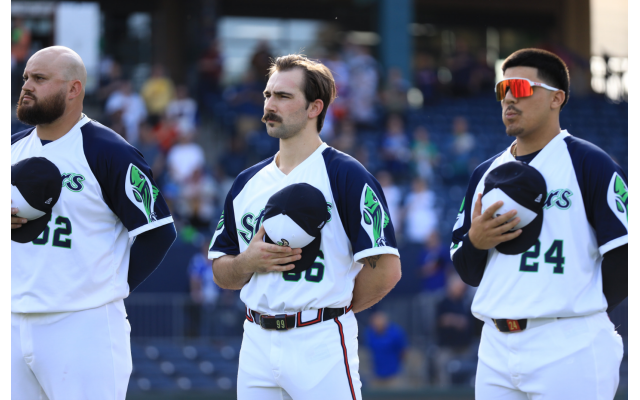 Rowdy Tellez (left) standing alongside rehabbing Braves ace Spencer Strider and infielder Nacho Alvarez during the national anthem of a recent Gwinnett Stripers game. The Jewish veteran first baseman/DH is hoping to join Strider in Atlanta at some point this summer // Photo Credit: Gwinnett Stripers 