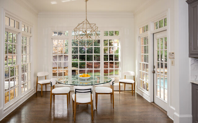 The expansive family kitchen brings in nature from all sides. 