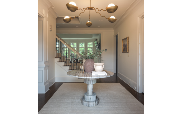 The entrance foyer displays the chandelier that Brooke “went crazy over” from Lulu and Georgia. 