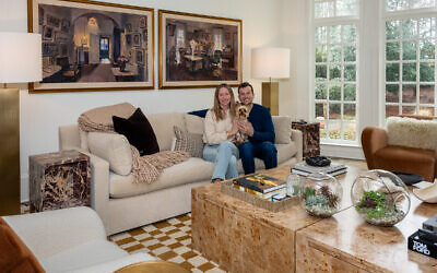 Brooke and Matt Polacheck are in front of two paintings by Robert MacDonald Graham; 4-year-old Yorkie Oscar enjoys the attention // All photos by Howard Mendel