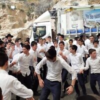 Some 20,000 celebrants packed the Tomb of Shimon haTzadik creating a carnival-like atmosphere with candy floss and hora circle dancing.
