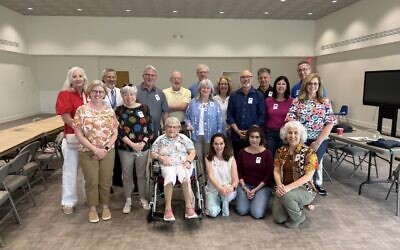 The Hebrew Academy’s 1976 seventh-grade class recently held their 50th reunion. Pictured with the former students is their kindergarten teacher, Isabelle Maslia.