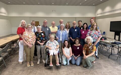 The Hebrew Academy’s 1976 seventh-grade class recently held their 50th reunion. Pictured with the former students is their kindergarten teacher, Isabelle Maslia.