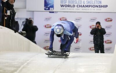 On his skeleton rides, Firestone dives headfirst down an icy track on a small sled, reaching speeds of up to 90 miles per hour // Photo Credit: Ken Childs 