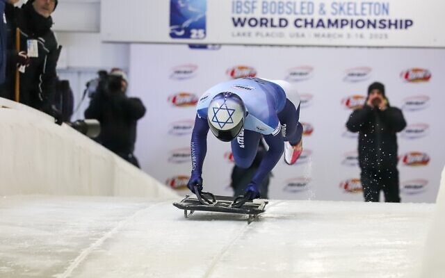 On his skeleton rides, Firestone dives headfirst down an icy track on a small sled, reaching speeds of up to 90 miles per hour // Photo Credit: Ken Childs 