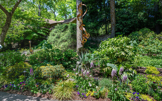 David Horwitz created 12-foot copper structures to “plant” in almost three acres along streams // Photo by Howard Mendel  