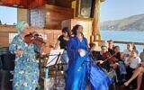 The group of ladies celebrated with singing and playing the drums, flutes, violins, and harps.
