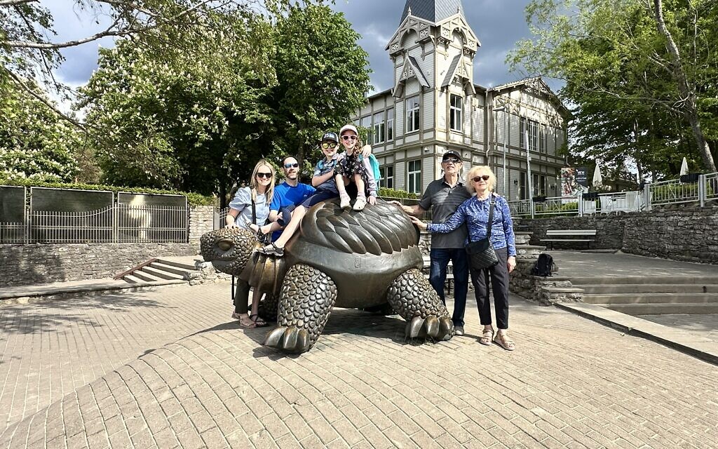 The family posed at the Turtle statue at Jurmala, known for its healing and spa culture.