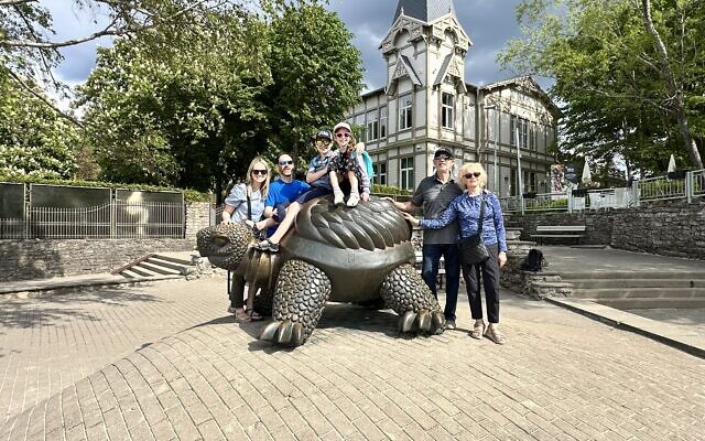 The family posed at the Turtle statue at Jurmala, known for its healing and spa culture.