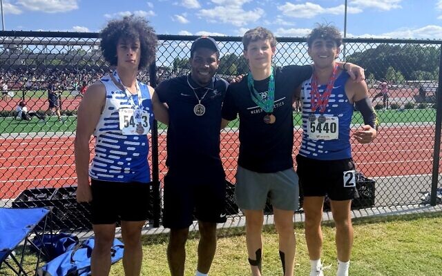 The Weber School track & field state medalists, from left: Eli Clark, Coach Trey Carson, Ryan Kasmen, Nuriel Shimoni-Stoil // Photo Credit: Trey Carson