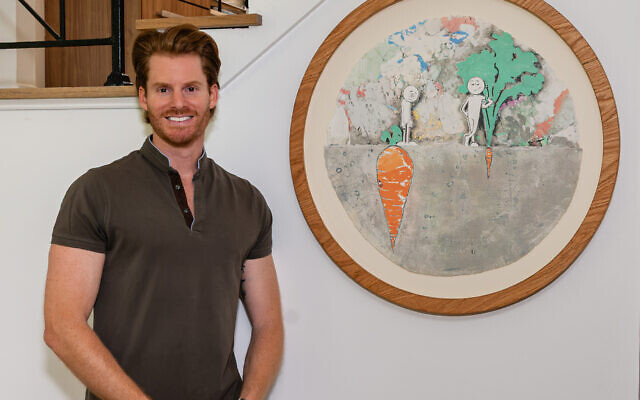 Philippe poses by one of his favorite pieces by KAI, a juxtaposition between what’s seen and what’s perceived, “Perspective.” The concrete look and deckled edges of the print are cohesive with the artist’s stand-alone techniques. 