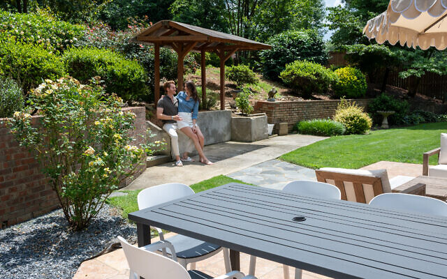 Philippe and Laura are in the process of perfecting the backyard for entertaining. Laura’s herb garden also has lavender, fig trees, tomatoes, and blueberries. They inherited irises, azaleas, roses and gardenias from the previous homeowner.