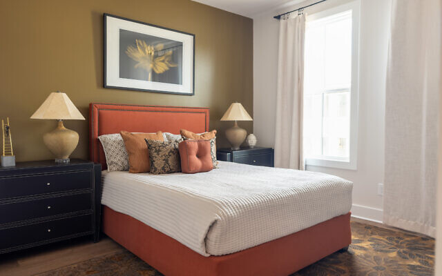 Gary describes his tangerine hued guest room as autumnal and seasonal. 
