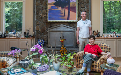 Gary Alembik visits mom, Judy, often. Both are pictured in her living room, centered by part of Wolverine’s “Candler Park” series // All photos by Howard Mendel
