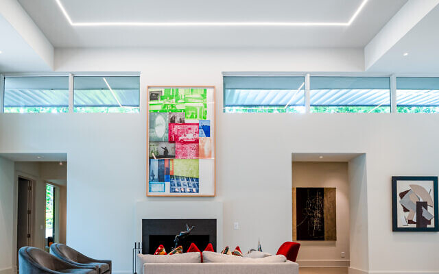 The living area shows off the high-tech low voltage ribbon lighting. The piece over the fireplace is a Robert Rauschenberg-signed and numbered lithograph.