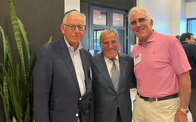 Alan Lubel (left) and Dr. Alan Sunshine flank charismatic speaker, Sol Werdiger.